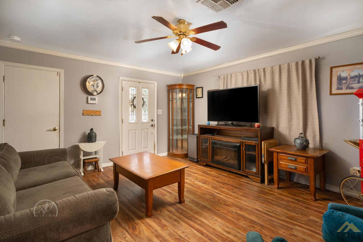 Undisclosed Address Taft, CA 93268 - Photo 3 of 21 a living room with furniture and a flat screen tv