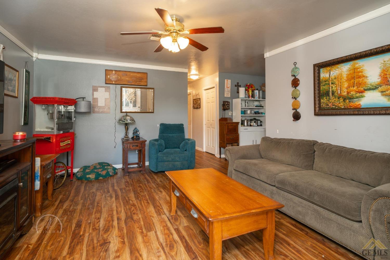 Undisclosed Address Taft, CA 93268 - Photo 4 of 21 a living room with furniture and wooden floor