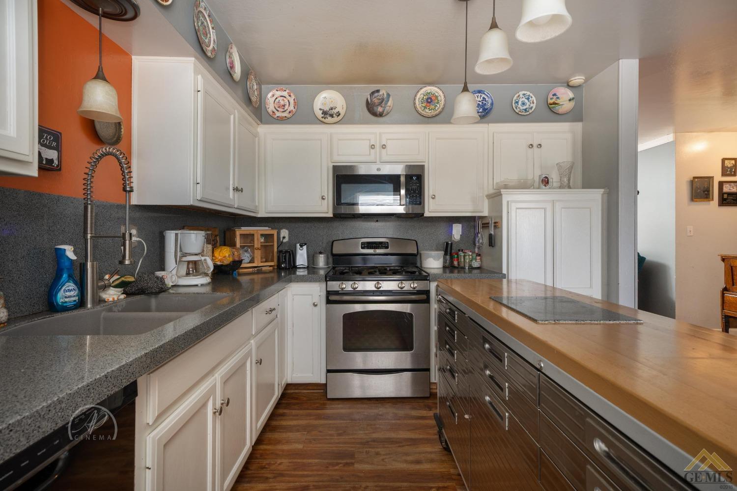 Undisclosed Address Taft, CA 93268 - Photo 6 of 21 a kitchen with stainless steel appliances granite countertop a sink and a stove