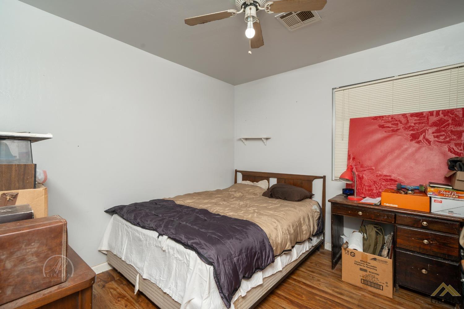 Undisclosed Address Taft, CA 93268 - Photo 9 of 21 a bedroom with a bed and ceiling fan
