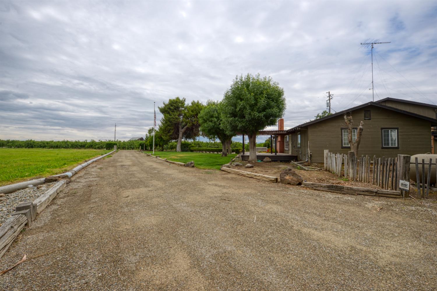 2931 East Marshall Road Patterson, CA 95363 - Photo 9 of 54 Area to drive in front of Home to the sheds, barn and Shop