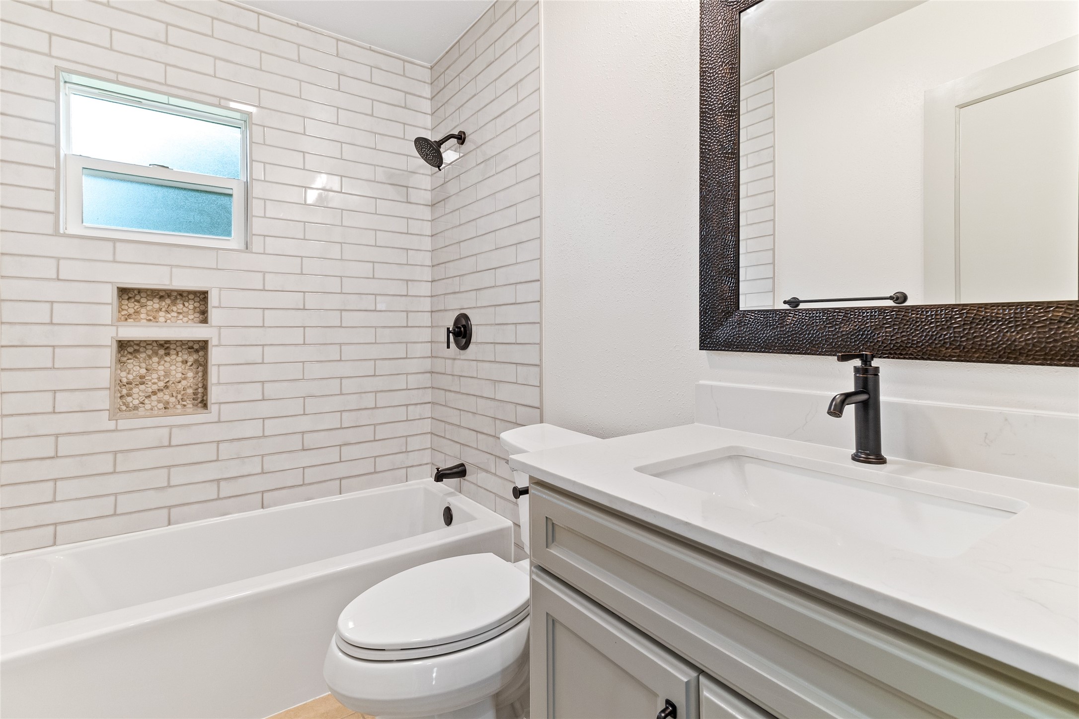 1108 Nottingham Drive Angleton, TX 77515 - Photo 16 of 23 a bathroom with a sink a toilet and a bathtub