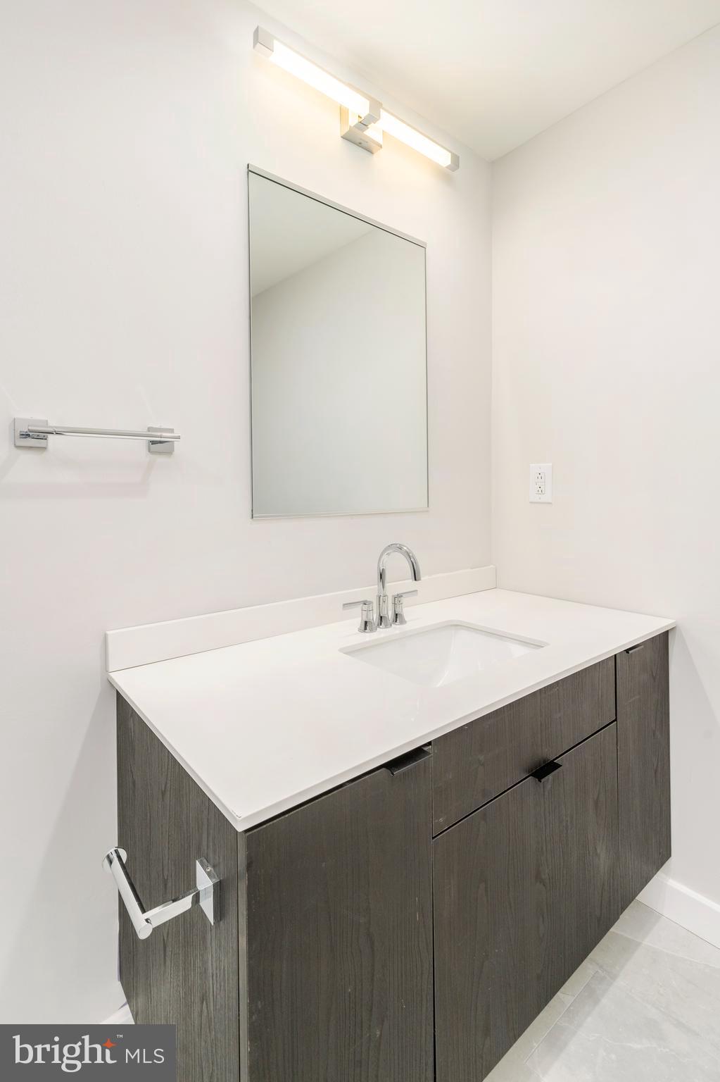 3449 Scotts Lane, Unit B221 Philadelphia, PA 19129 - Photo 12 of 21 a bathroom with a sink and a mirror
