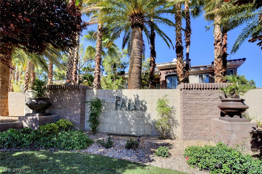9050 West Warm Springs Road, Unit 1034 Las Vegas, NV 89148 - Photo 14 of 17 A grand gated entrance welcomes residents to a community nestled amongst tropical palms.