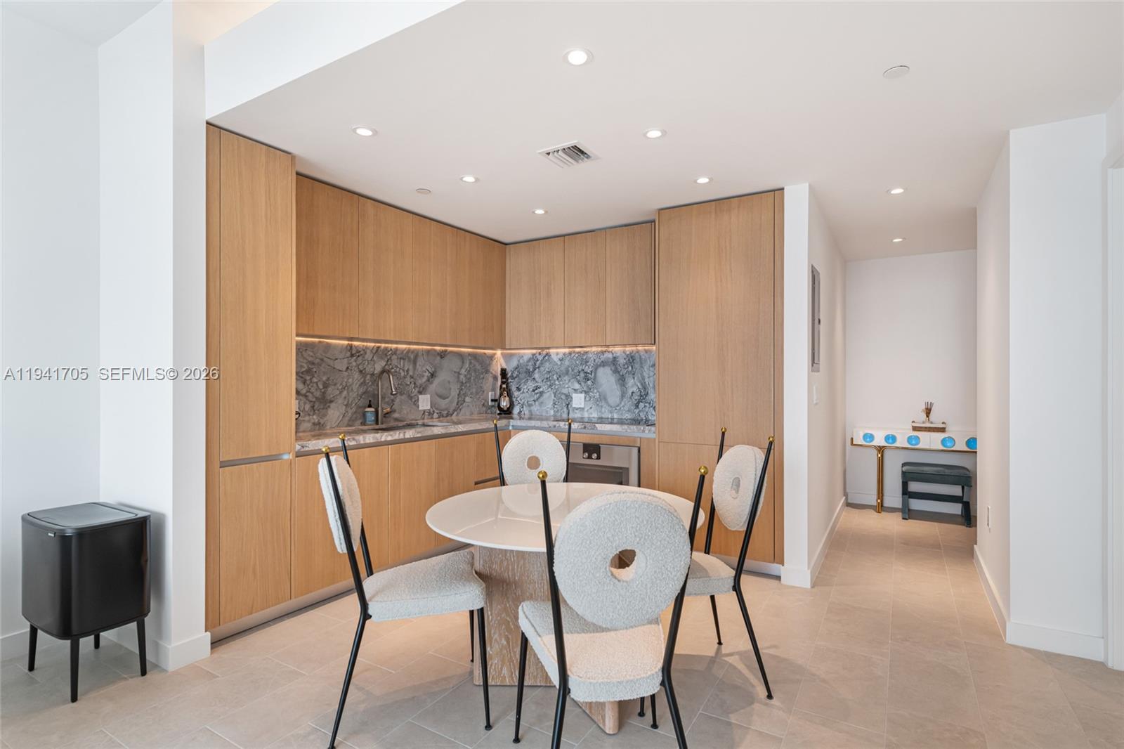 500 Alton Road, Unit 1204 Miami Beach, FL 33139 - Photo 3 of 22 a view of a dining room with furniture