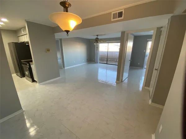a view of a hallway with a chandelier