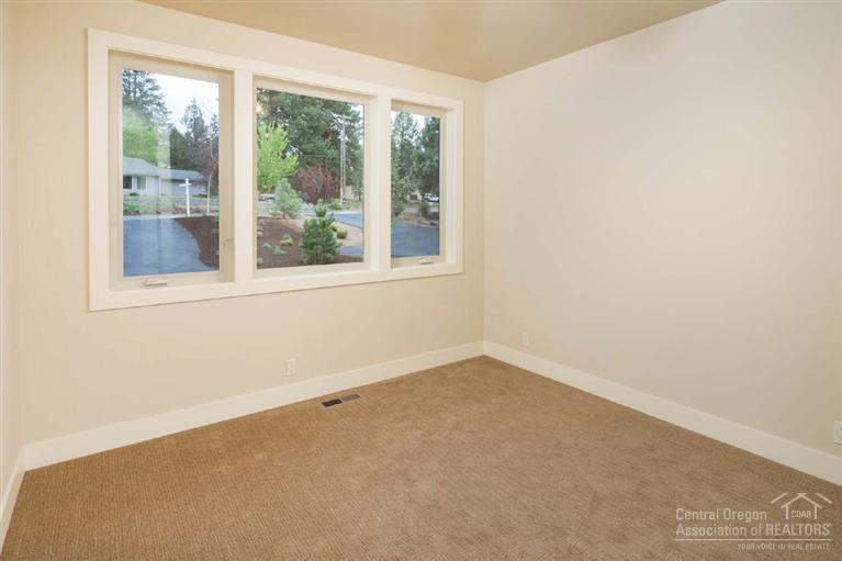 61515 Southwest Blakely Road Bend, OR 97702 - Photo 9 of 20 an empty room with a window