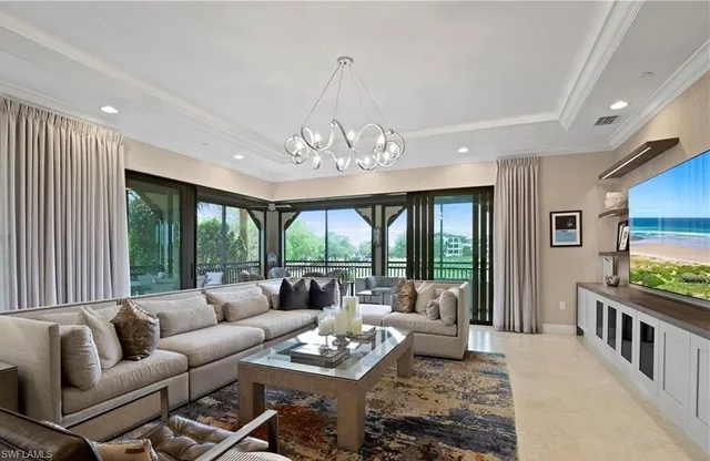 a large kitchen with stainless steel appliances kitchen island granite countertop a lot of counter space and a sink