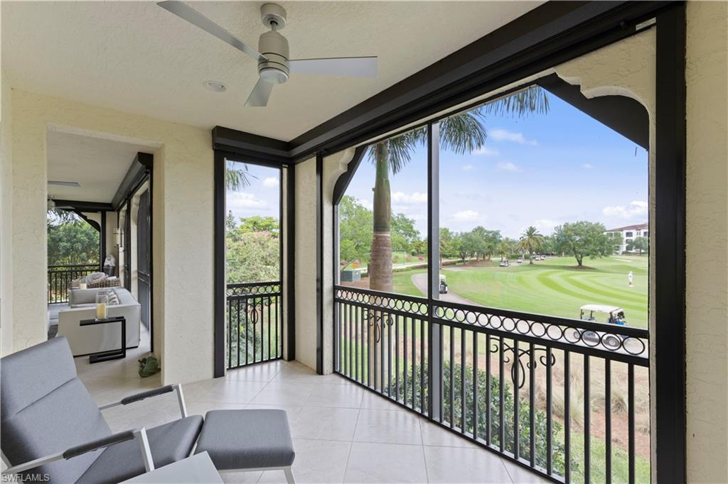 16391 Viansa Way, Unit 101 Naples, FL 34110 - Photo 28 of 48 a view of a porch with furniture and floor to ceiling window