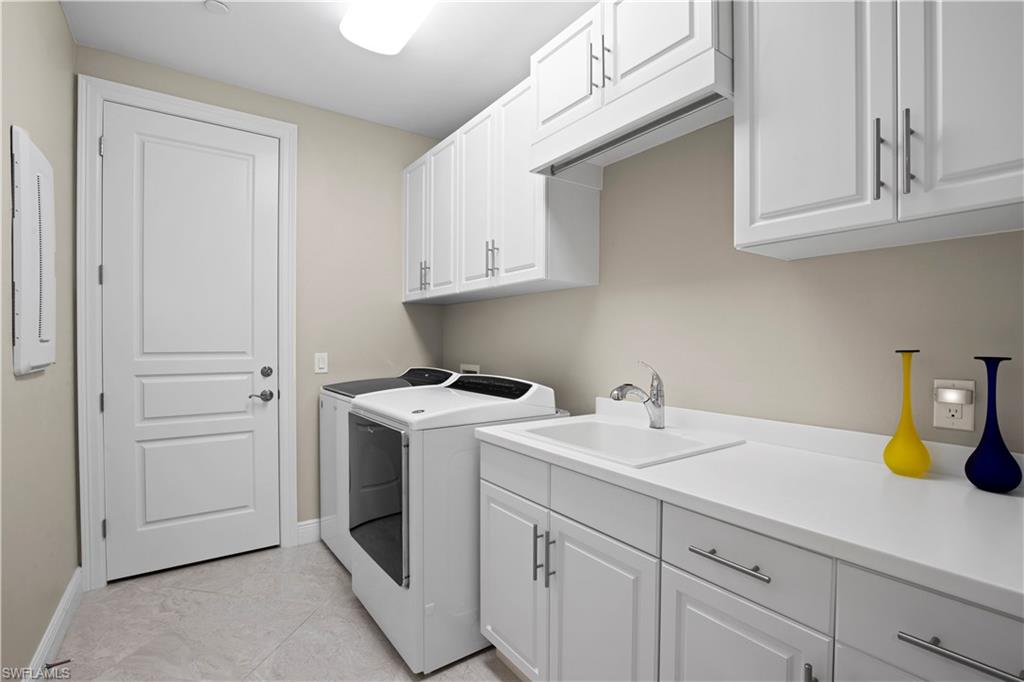 16391 Viansa Way, Unit 101 Naples, FL 34110 - Photo 36 of 48 a view of a storage and utility room with sink