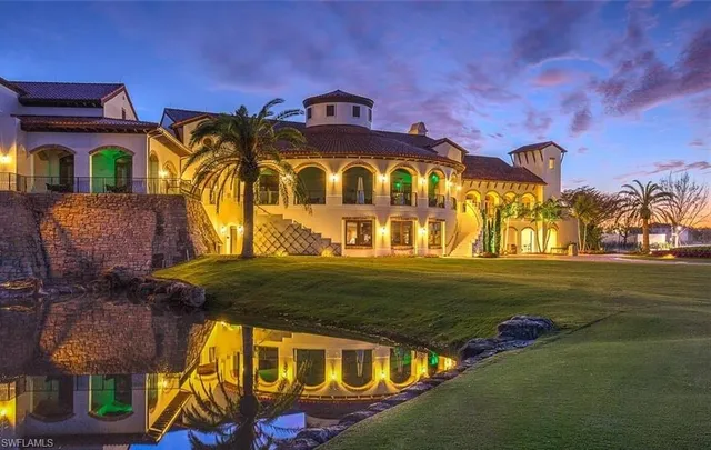 a outdoor space with lots of tables a large window and chairs