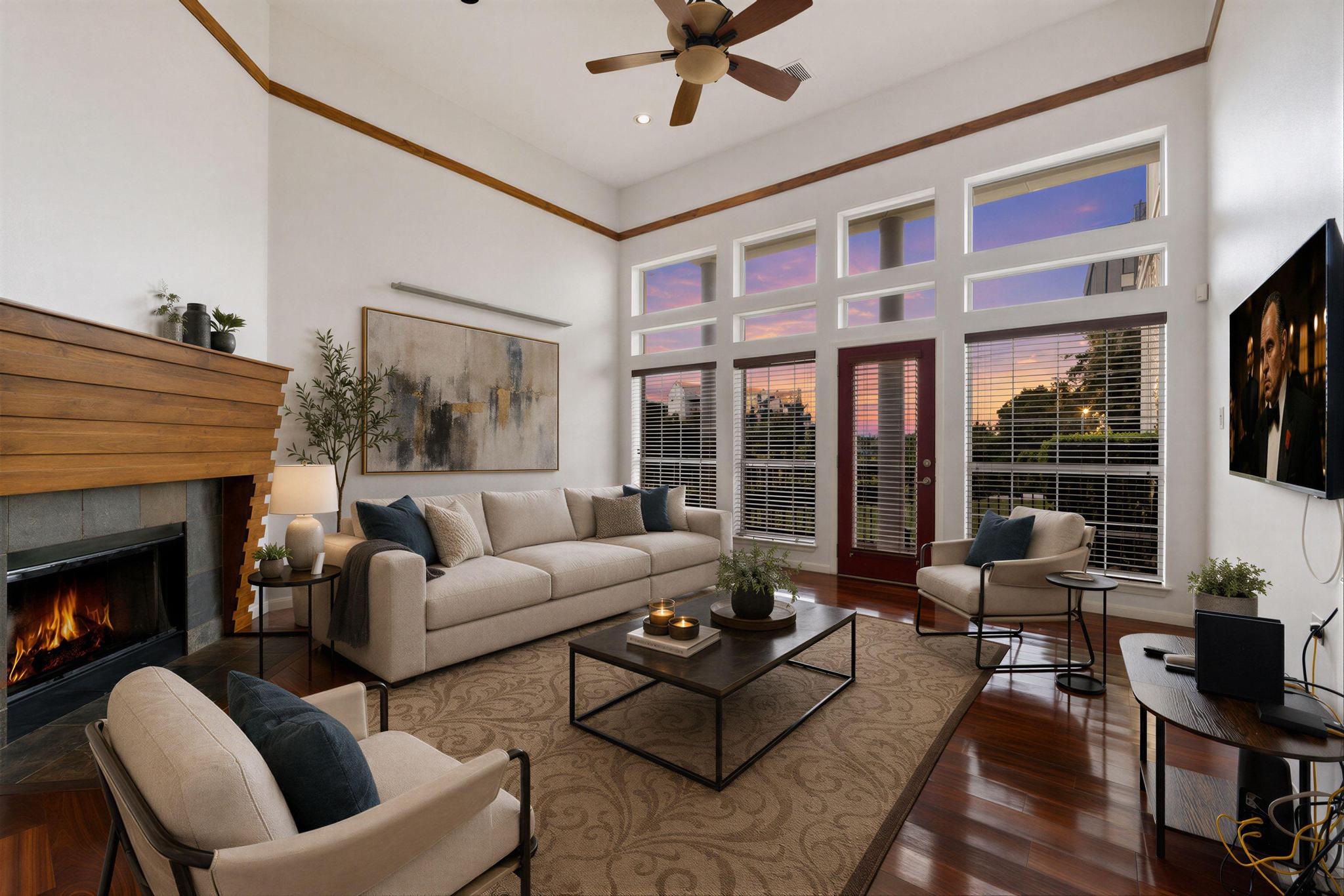 2918 Ranch Road 620, Unit J162 Austin, TX 78734 - Photo 3 of 26 *Virtually staged living room - Vaulted ceilings highlight a wood-mantled fireplace with a dark stone surround and rich wood-finish flooring.