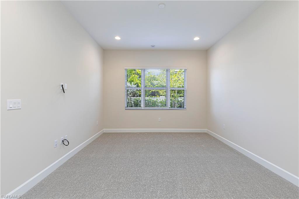 2691 Ridgecrest Place Naples, FL 34112 - Photo 15 of 27 an empty room with windows