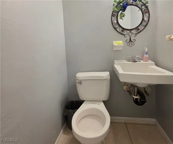 a bathroom with a toilet and a sink