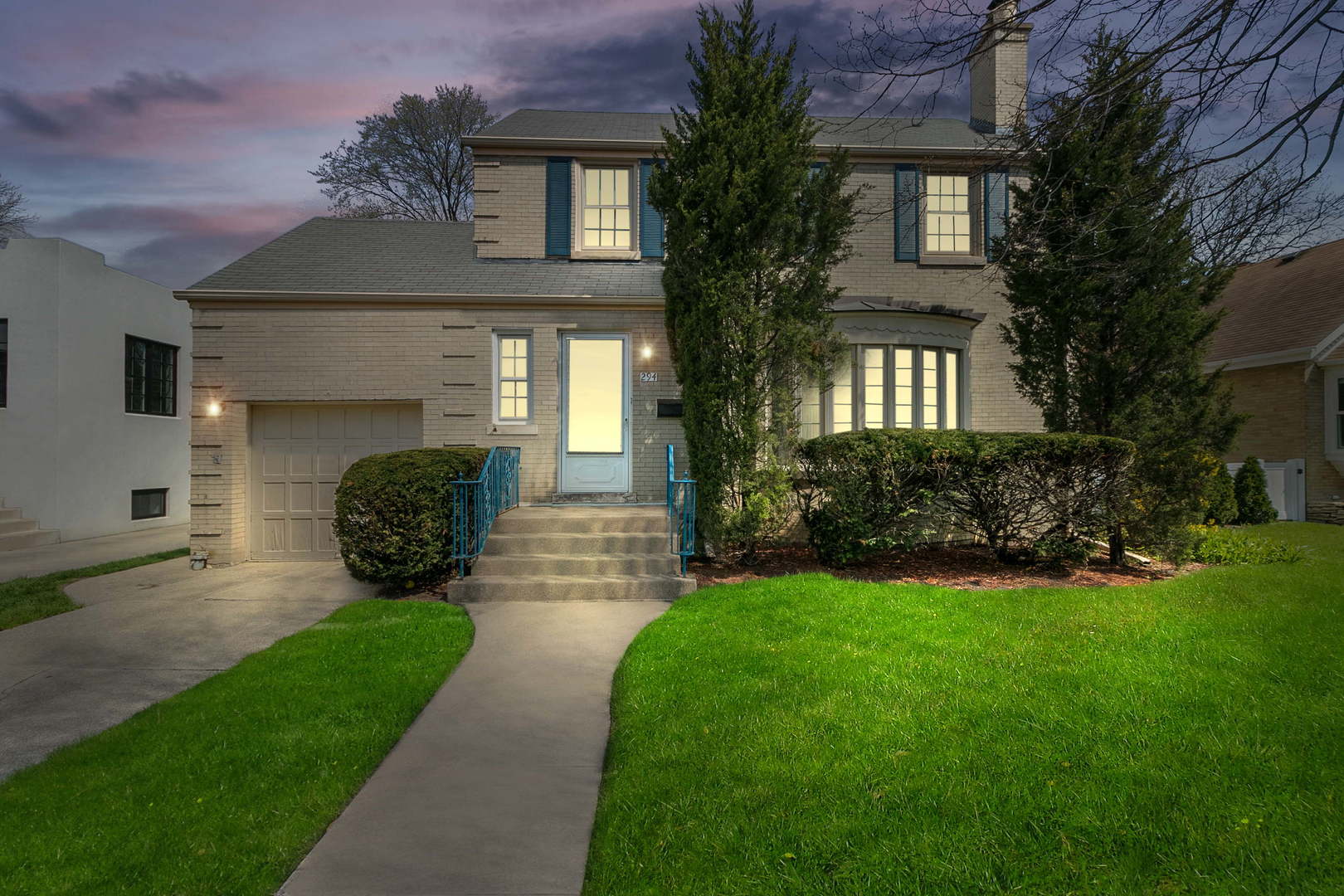 294 Shenstone Road Riverside, IL 60546 - Photo 1 of 29 a front view of a house with a yard and potted plants