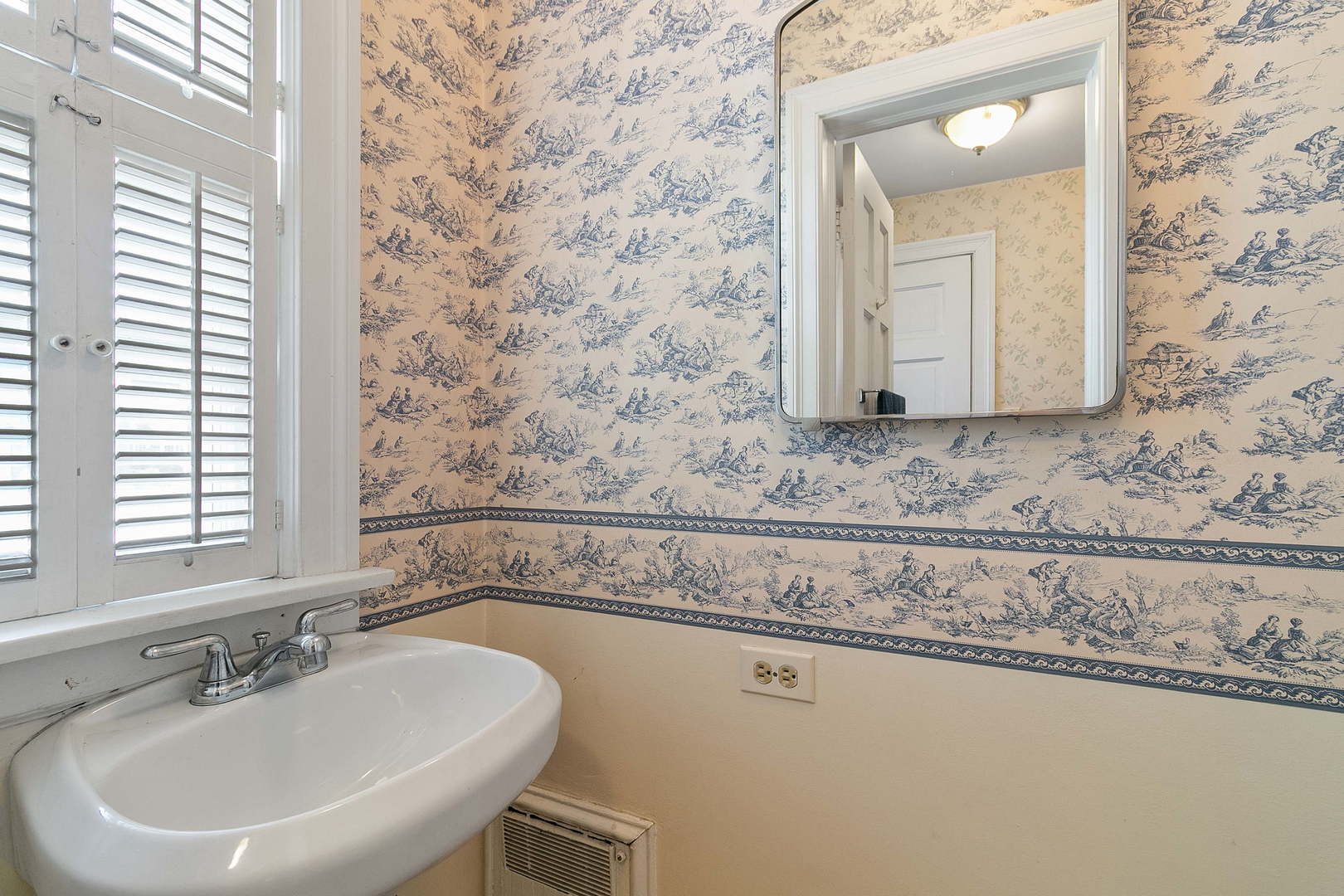 294 Shenstone Road Riverside, IL 60546 - Photo 11 of 29 a bathroom with a sink and a mirror