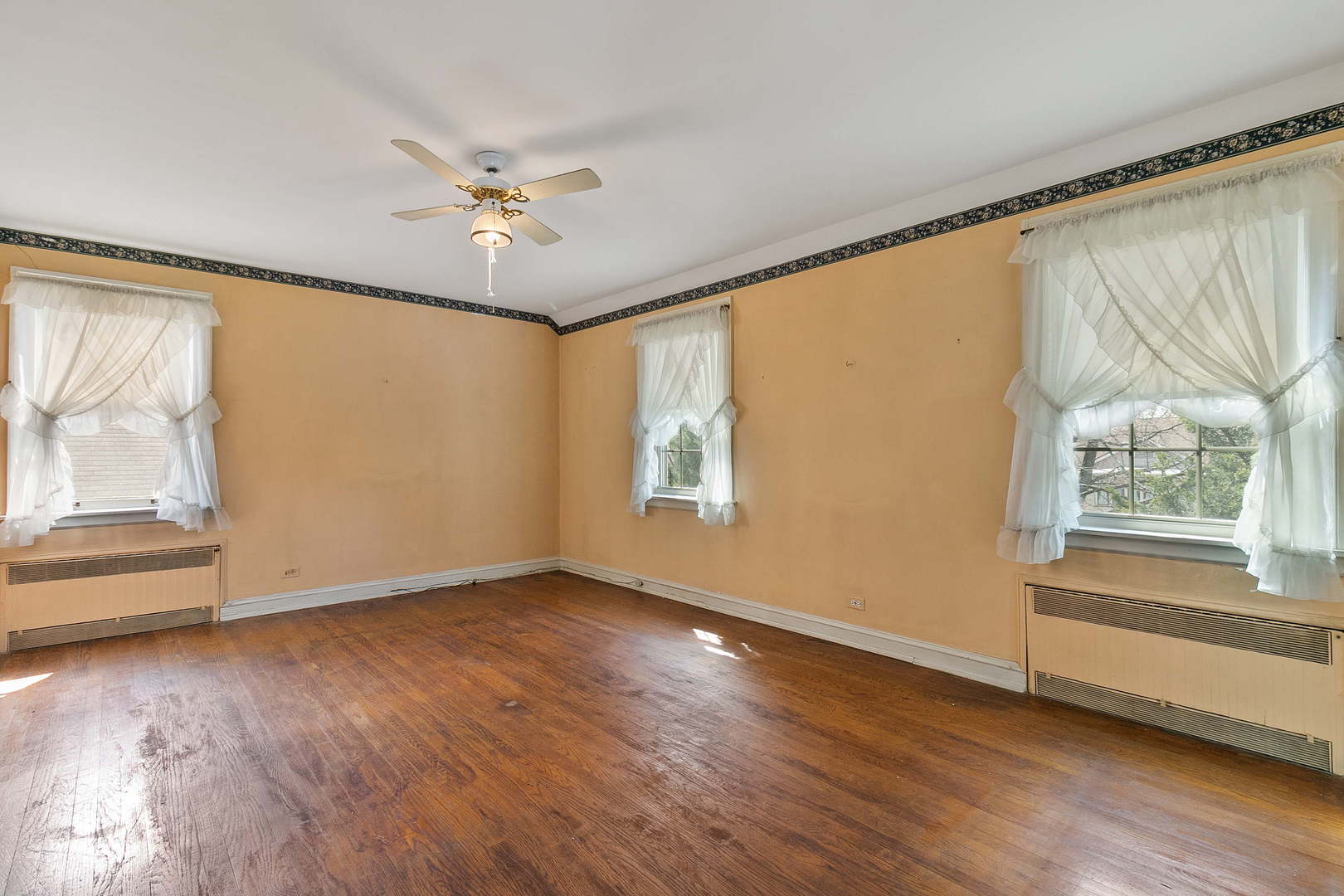 294 Shenstone Road Riverside, IL 60546 - Photo 13 of 29 a view of an empty room with a window and wooden floor