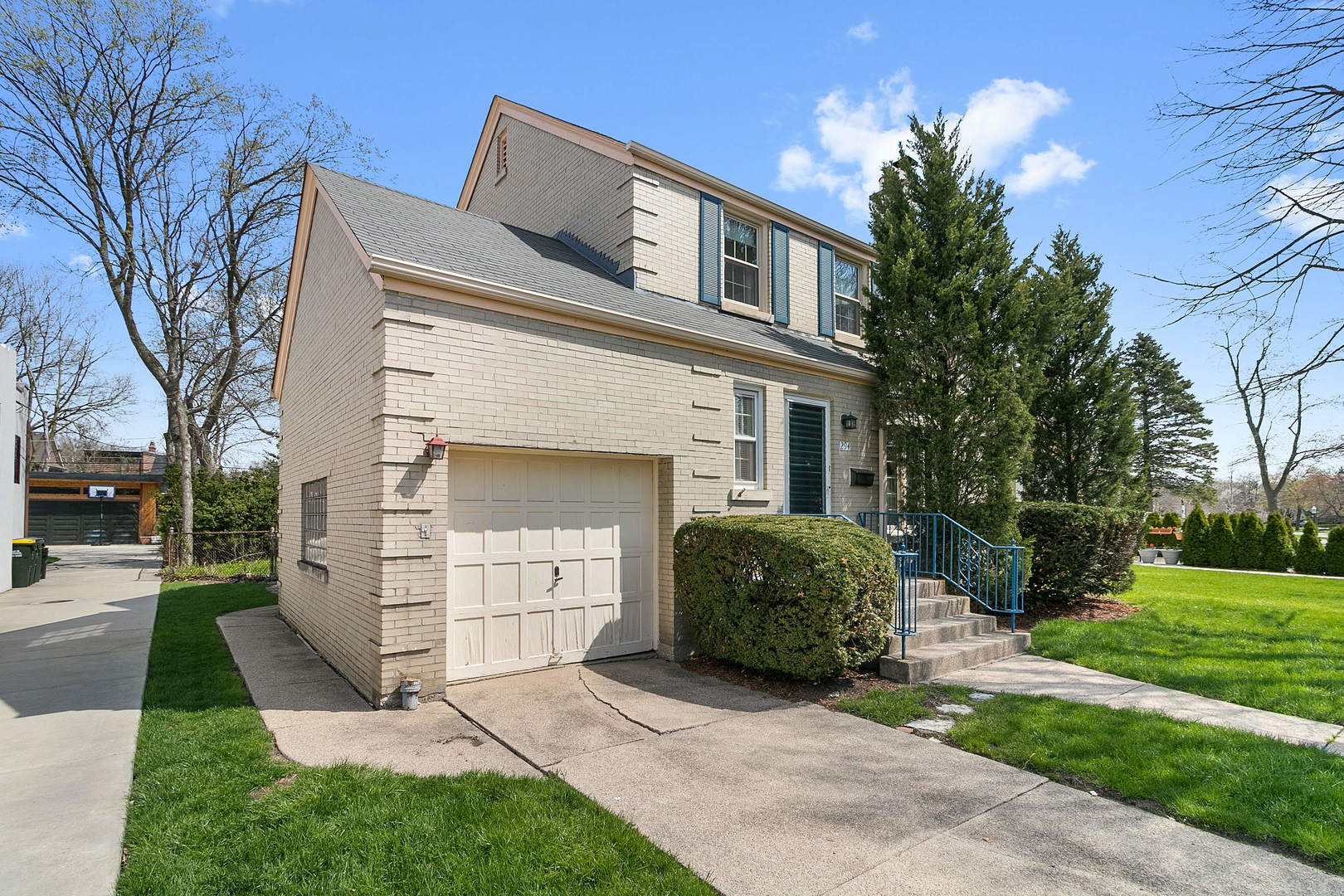 294 Shenstone Road Riverside, IL 60546 - Photo 20 of 29 a front view of a house with a yard and garage