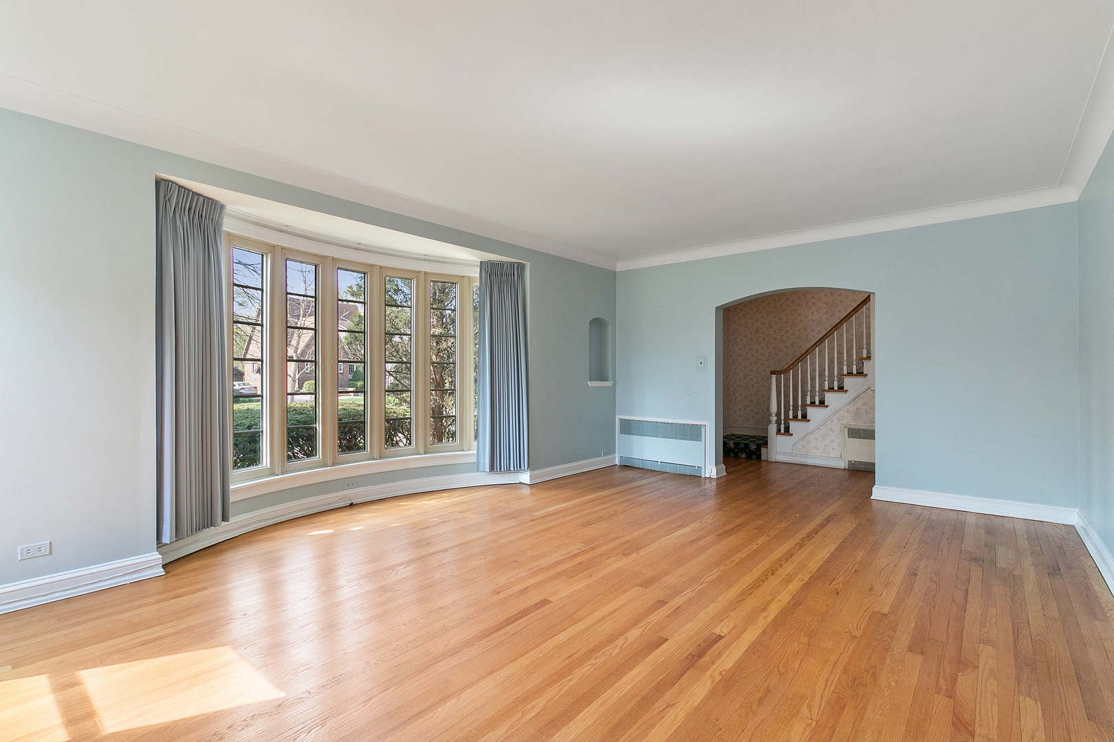 294 Shenstone Road Riverside, IL 60546 - Photo 2 of 29 a view of empty room with wooden floor and fan