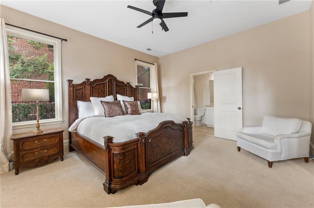 1950 Heritage Walk Alpharetta, GA 30004 - Photo 11 of 64 a spacious bedroom with a bed and a window