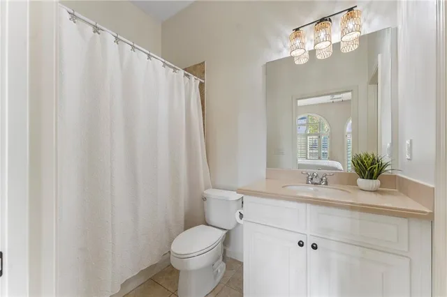 a living room with fireplace furniture and a large window