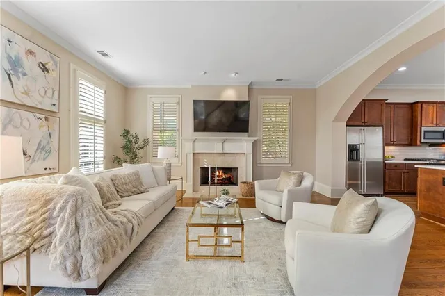 a living room with fireplace furniture and a flat screen tv