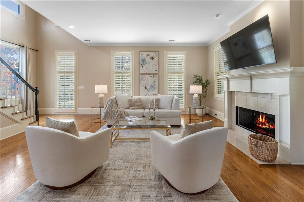 1950 Heritage Walk Alpharetta, GA 30004 - Photo 20 of 64 a living room with fireplace furniture and a flat screen tv