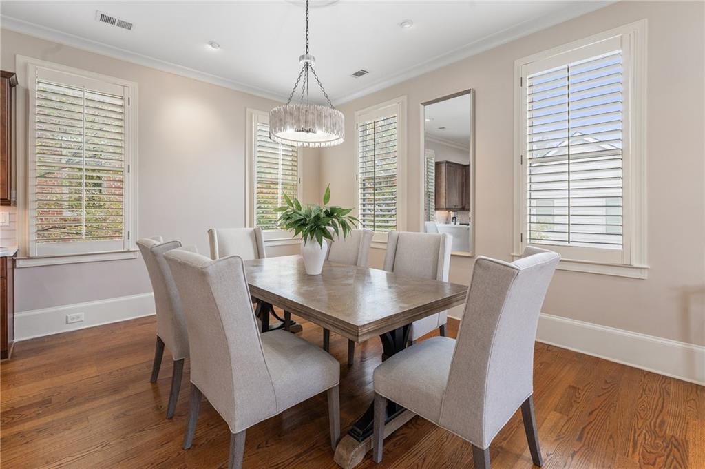 1950 Heritage Walk Alpharetta, GA 30004 - Photo 29 of 64 a view of a dining room with furniture window and wooden floor