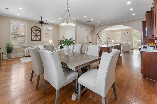 a spacious bedroom with a bed and a chandelier