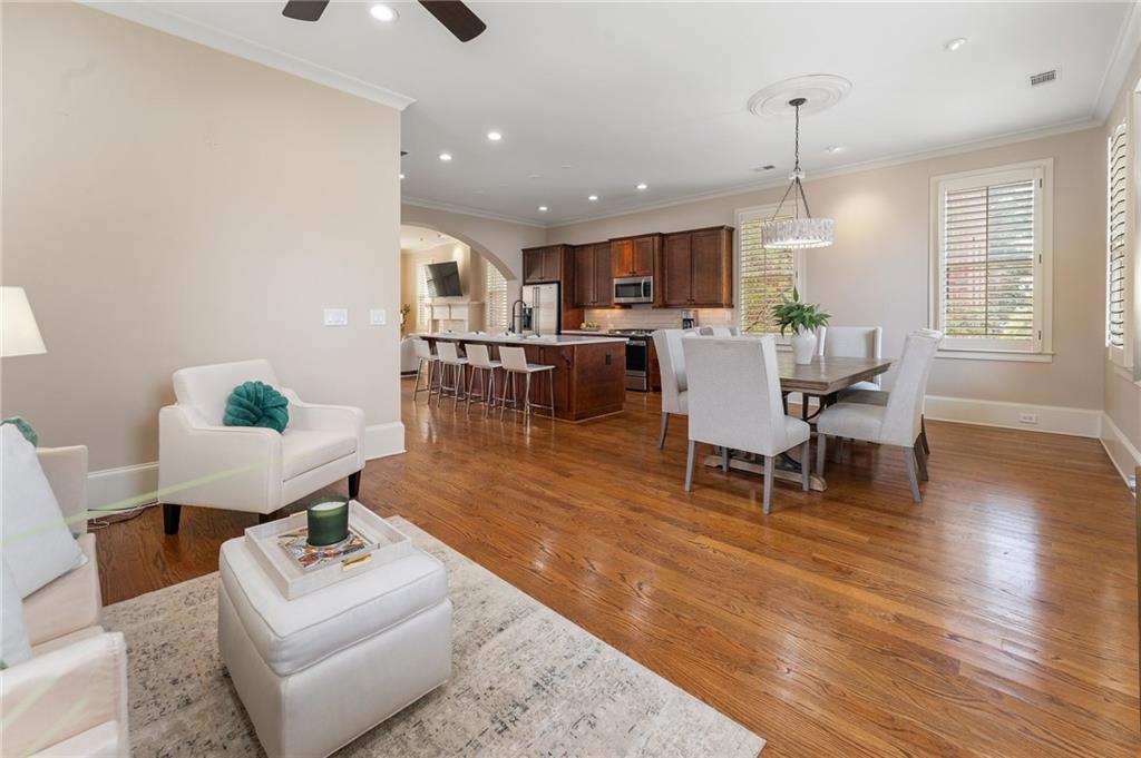 1950 Heritage Walk Alpharetta, GA 30004 - Photo 34 of 64 a living room with furniture and a wooden floor