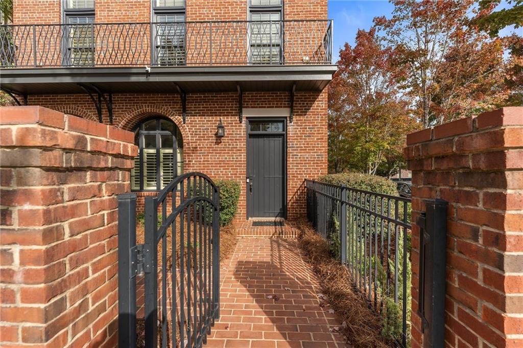 1950 Heritage Walk Alpharetta, GA 30004 - Photo 4 of 64 a close view of a dinning table and chairs with wooden fence