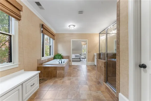 a view of a brick house with many windows