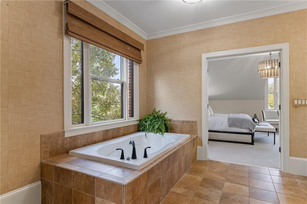 1950 Heritage Walk Alpharetta, GA 30004 - Photo 46 of 64 a bathroom with a tub sink and window