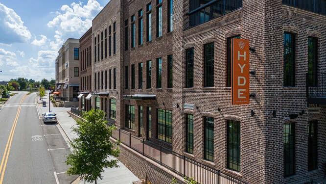 1950 Heritage Walk Alpharetta, GA 30004 - Photo 56 of 64 a view of a brick house with many windows