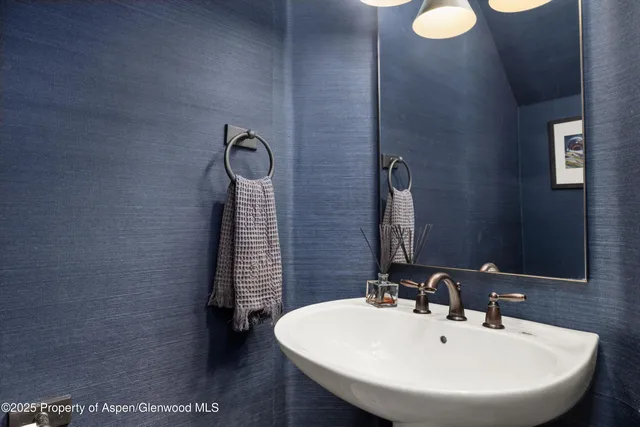 a bathroom with a sink double vanity and a mirror