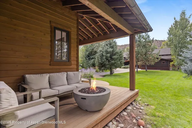 a view of a patio in the backyard