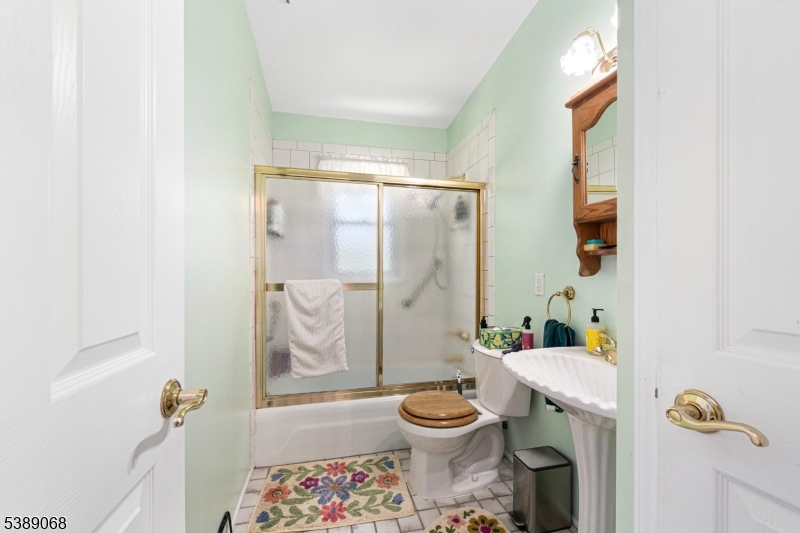 53 White Meadow Road Rockaway, NJ 07866 - Photo 15 of 40 a bathroom with a toilet sink and shower