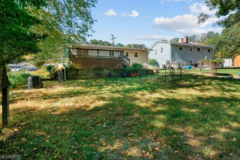 53 White Meadow Road Rockaway, NJ 07866 - Photo 16 of 40 a view of a house with a yard and sitting area