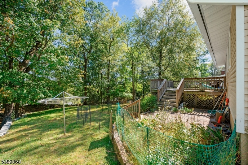 53 White Meadow Road Rockaway, NJ 07866 - Photo 18 of 40 a backyard of a house with table and chairs