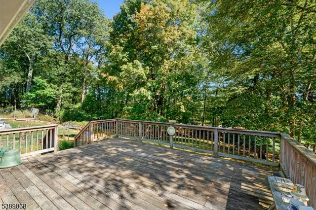 a view of a deck with two chairs and a table