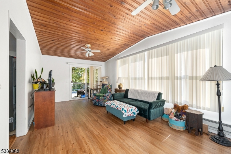 53 White Meadow Road Rockaway, NJ 07866 - Photo 3 of 40 a living room with furniture and a large window