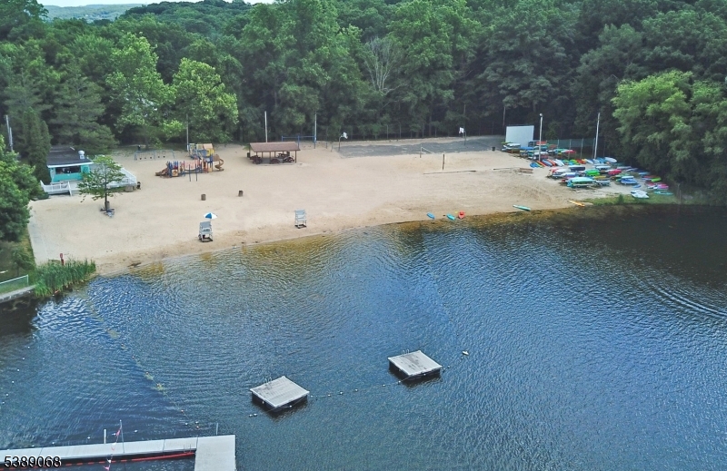 53 White Meadow Road Rockaway, NJ 07866 - Photo 32 of 40 a view of a swimming pool with a yard
