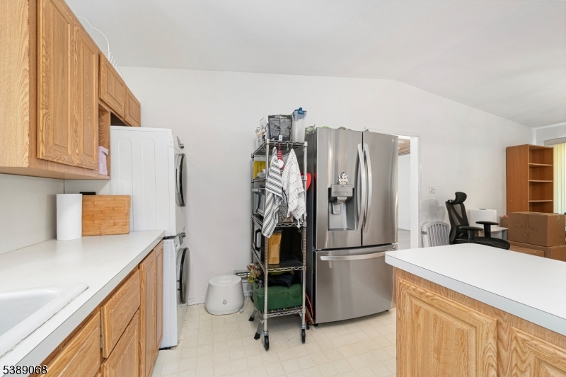 53 White Meadow Road Rockaway, NJ 07866 - Photo 9 of 40 a kitchen with a refrigerator and cabinets