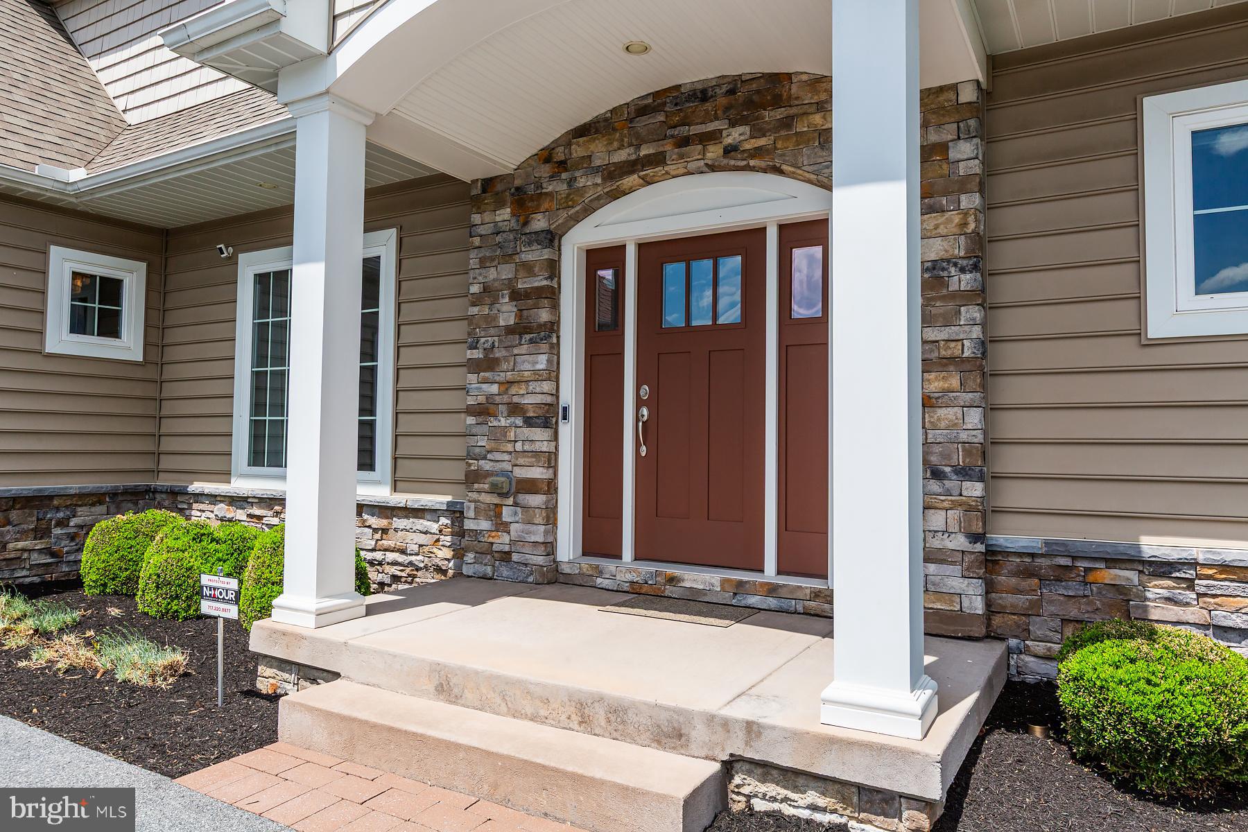 425 East Delp Road Lancaster, PA 17601 - Photo 14 of 109 a front view of a house with potted plants