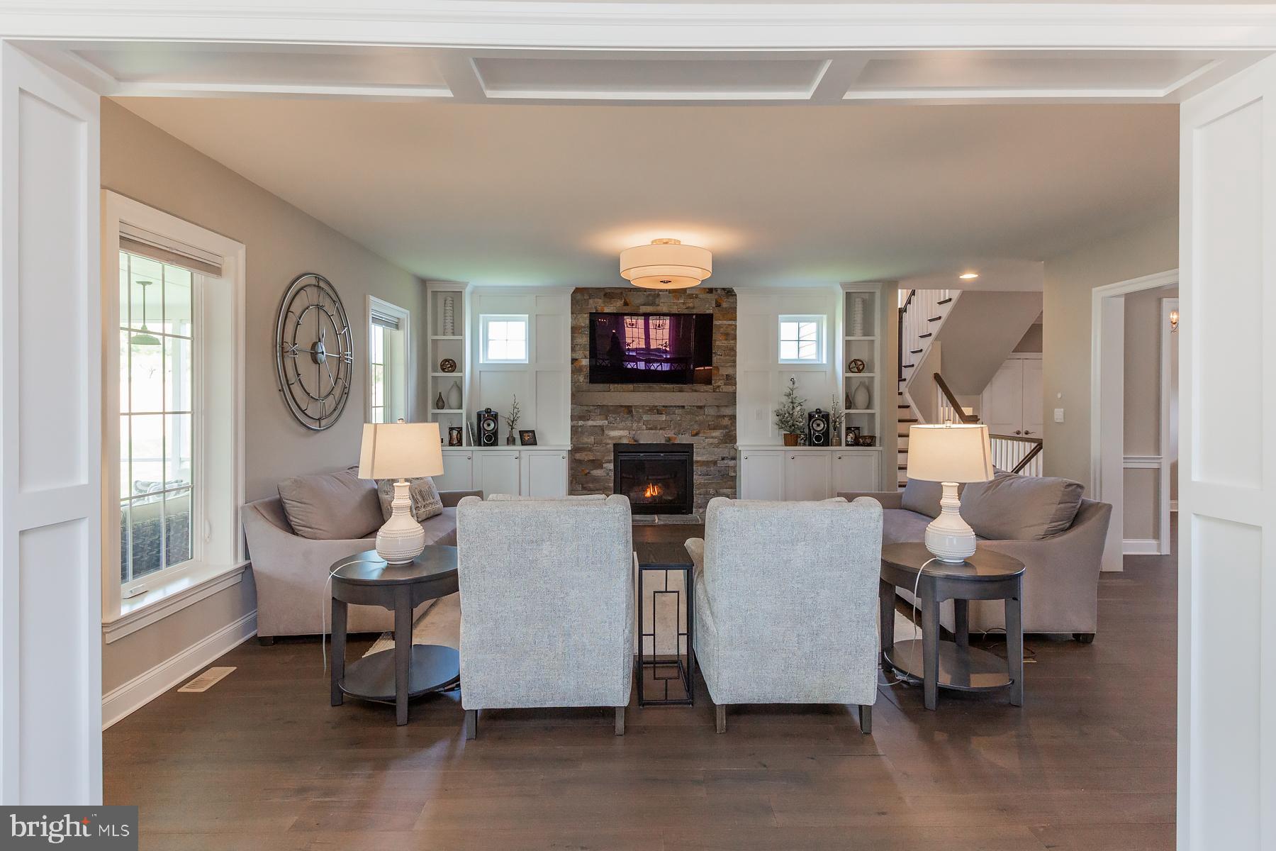 425 East Delp Road Lancaster, PA 17601 - Photo 21 of 109 a living room with furniture a fireplace and a large window