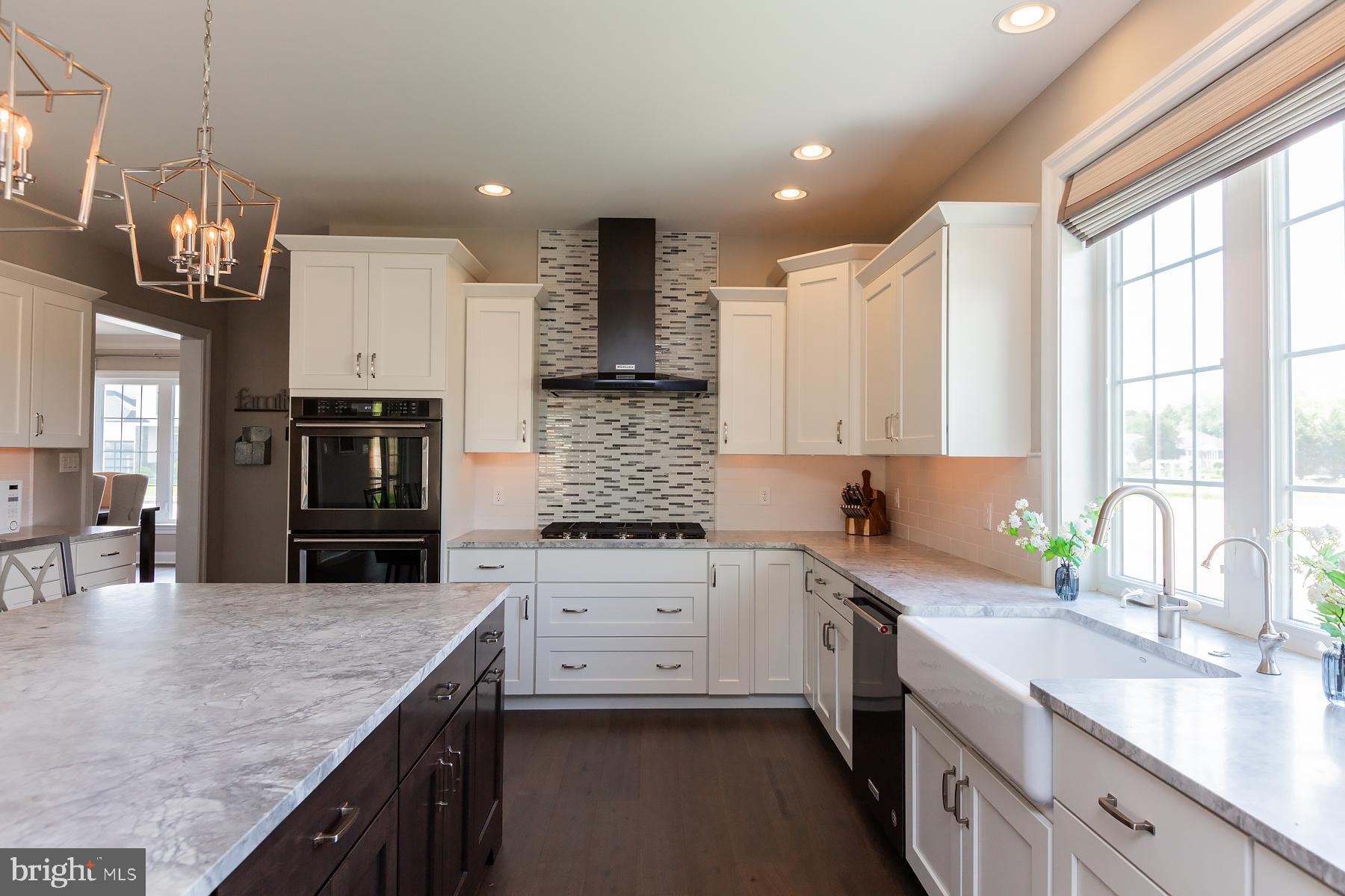 425 East Delp Road Lancaster, PA 17601 - Photo 35 of 109 a kitchen with stainless steel appliances granite countertop a sink stove and refrigerator