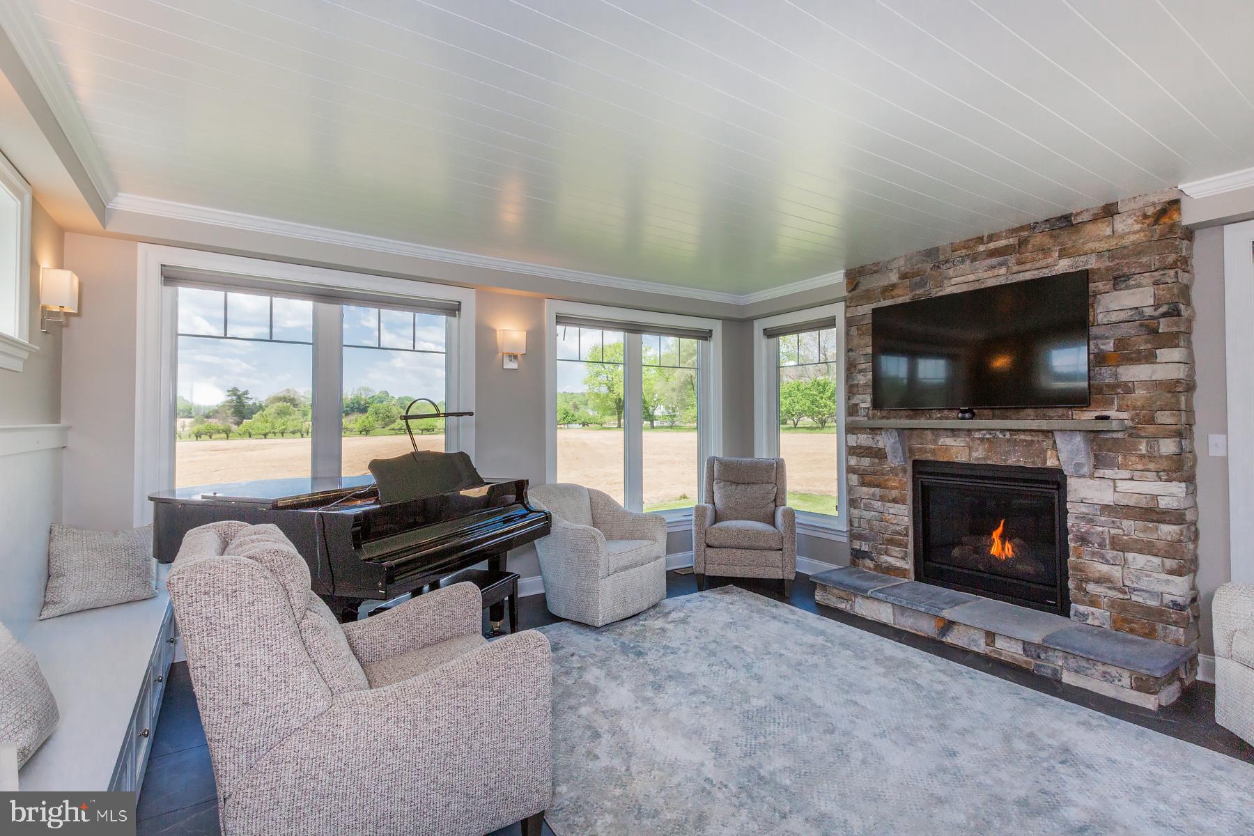 425 East Delp Road Lancaster, PA 17601 - Photo 47 of 109 a living room with furniture a flat screen tv and a fireplace