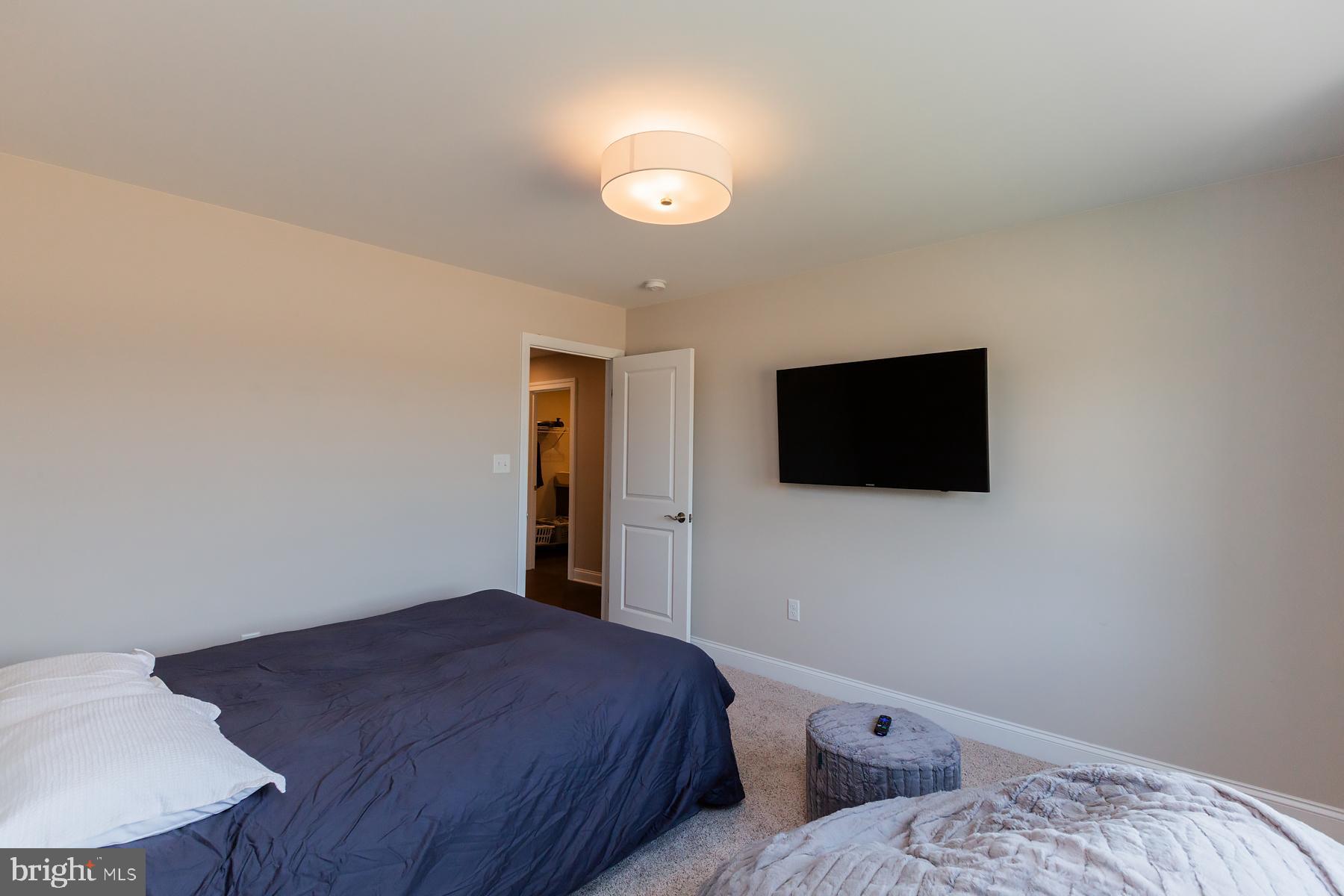 425 East Delp Road Lancaster, PA 17601 - Photo 73 of 109 a bedroom with a bed and a flat screen tv