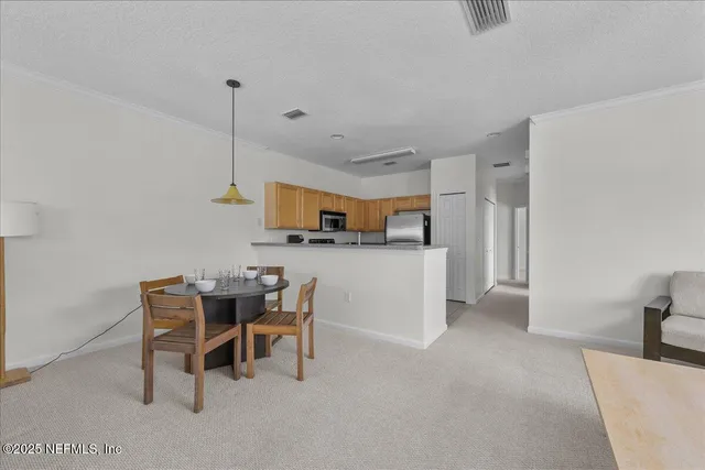 a kitchen with a sink cabinets and window