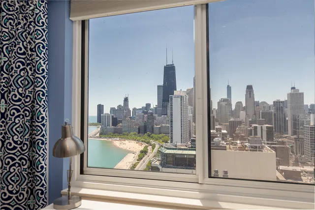 a view of a city from a corridor